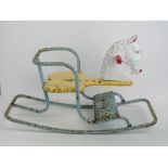 A vintage Tri-ang rocking horse, 67cm in length.