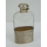 A HM silver and cut glass flask, the silver lid complete with cork liner,