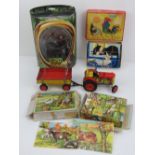 A contemporary tinplate tractor and trailer together with a Lord of the Rings figurine 'Gimli with