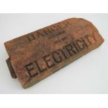 A vintage fired clay coping stone bearing 'Danger Electricity' upon. 31cm in length.