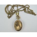 A 9ct gold vintage oval locket, slightly a/f, on 9ct gold necklace, each hallmarked 375.