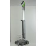 A Gtech Air Ram 22v cordless hoover with charger and operating manual.