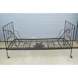 A late 19th century cast iron folding day bed, 183 x 81cm.