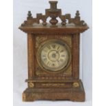 A Continental Viennese style table clock having Arabic numerals,