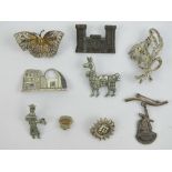 A quantity of brooches including an 800 silver filigree butterfly, 925 silver and marcasite brooch,
