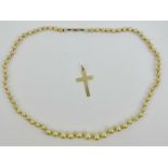 A 9ct gold cross pendant, hallmarked Birmingham, approx 3cm in length and weighing 0.8g.