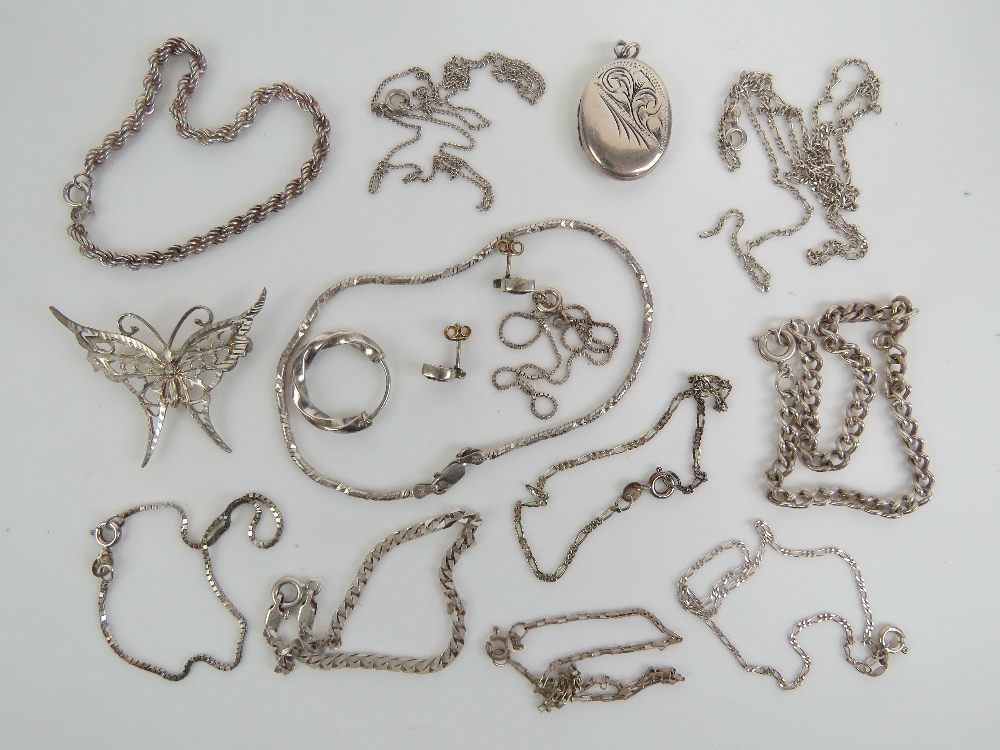 A quantity of silver jewellery including a butterfly brooch, a locket, a pair of earrings,