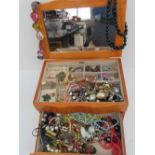 A quantity of assorted costume jewellery contained within a contemporary jewellery box having