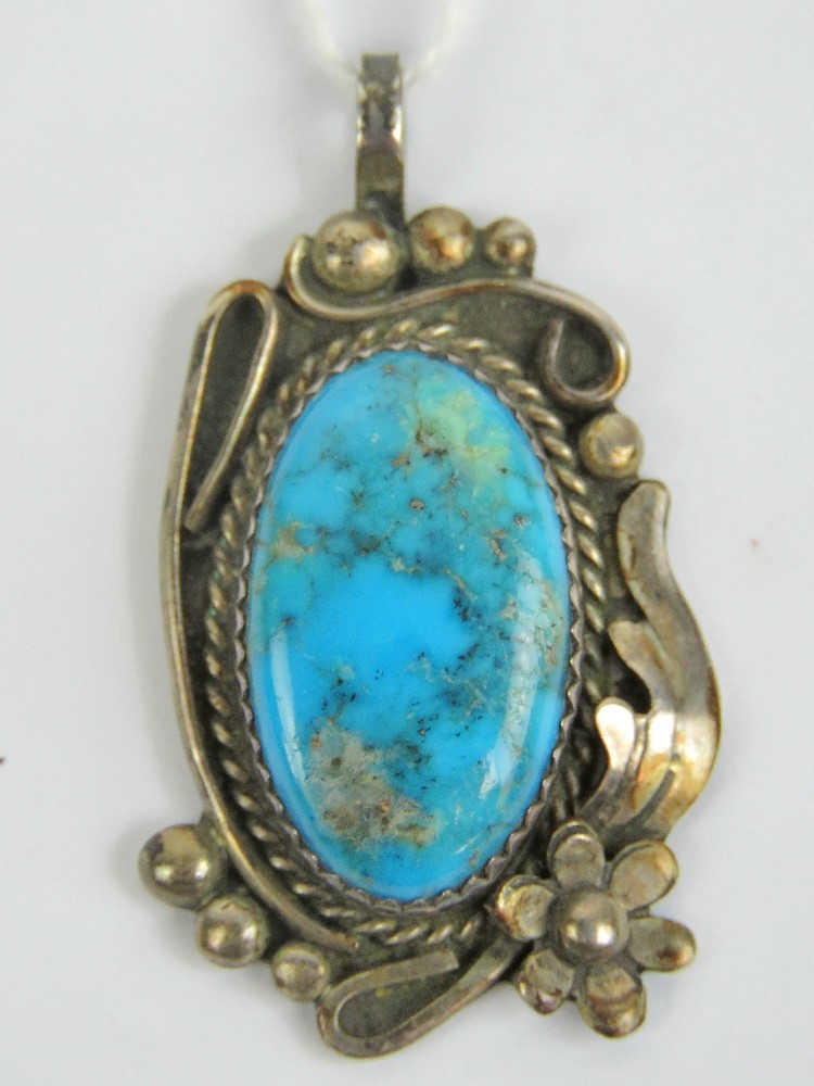 A Kelly Burton Native American Sterling silver and turquoise pendant, 4cm in length.