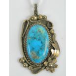 A Kelly Burton Native American Sterling silver and turquoise pendant, 4cm in length.