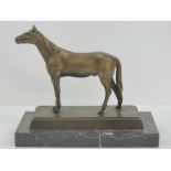 A bronzed cast metal figurine of a horse raised over marble plinth base, 19cm wide.