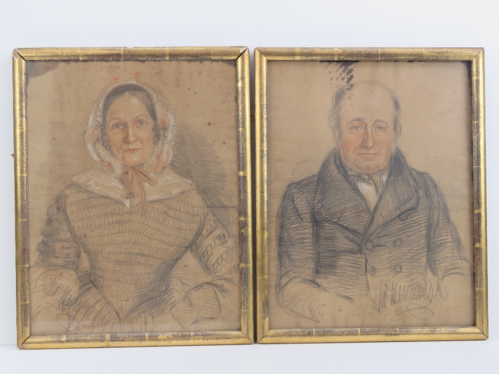 A pair of 19th century naive pastel and pencil portraits of a gentleman and lady,