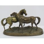 A heavy brass figure of two horses, marked to base R. Donaldson '82. 27cm wide.