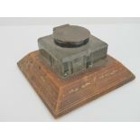 An Asprey desk inkwell having HM silver collar and lid and tan leather base,