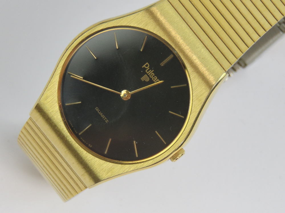 A Pulsar Quartz gold plated wristwatch having circular black ground face, - Image 2 of 4