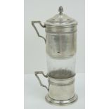A continental white metal coffee pot having indistinct hallmarks upon complete with strainer,