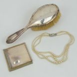 A silver hairbrush hallmarked for Birmingham 1929,