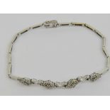 An 18ct white gold and diamond bracelet,