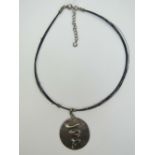 A silver and Abalone shell pendant on wire and silver chain, stamped 925,