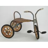 A Vintage Mobo tricycle having rubber ty