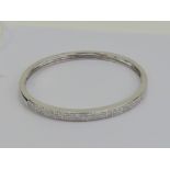 Am 18ct white gold hinged bangle encrust