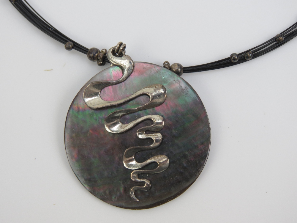 A silver and Abalone shell pendant on wi - Image 2 of 2