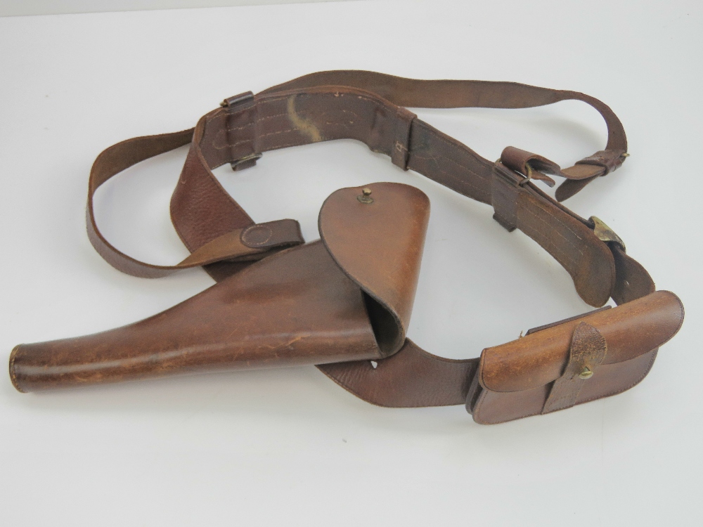 A WWI British Military Officers Sam Brown leather belt with shoulder strap and Webley .