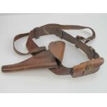A WWI British Military Officers Sam Brown leather belt with shoulder strap and Webley .