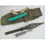 An inert Soviet RPG 9 rocket with transit tube for the fin section and carry bag.