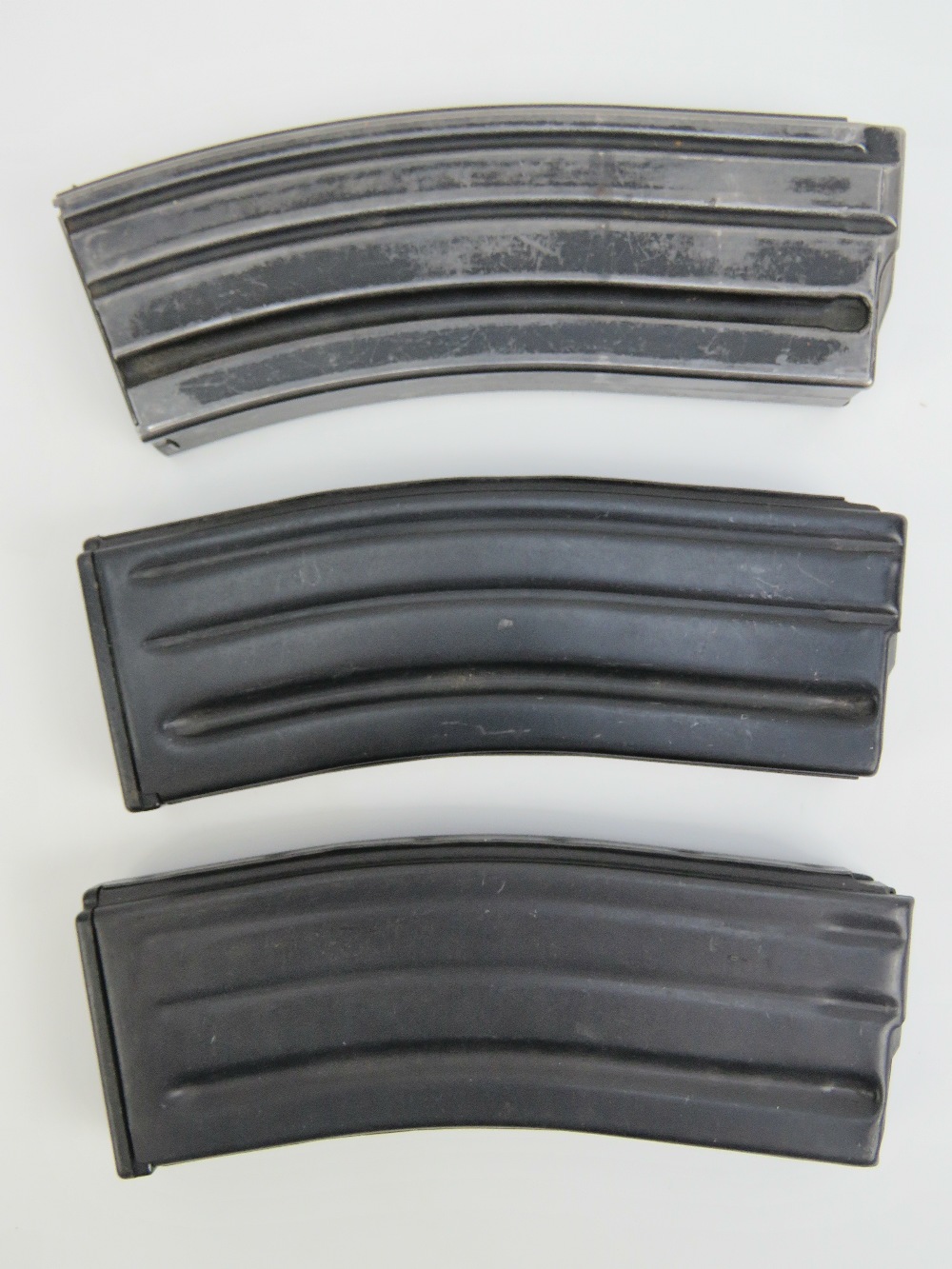 Three Sten gun magazines.