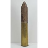 An inert British WWI 18lb high explosive shell with case, dated 1916,