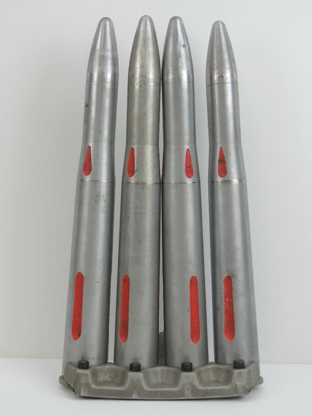 A set of four Bofors 40mm 2N inspection rounds 45cm high complete with clip.