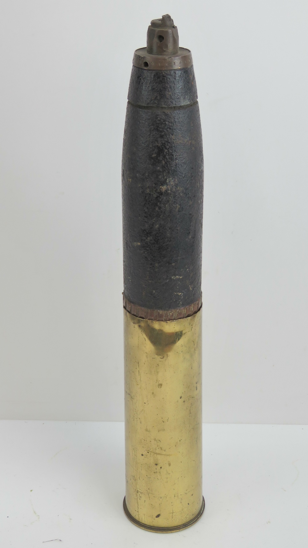 A Royal Artillery 25lb shell in case, 61cm tall.