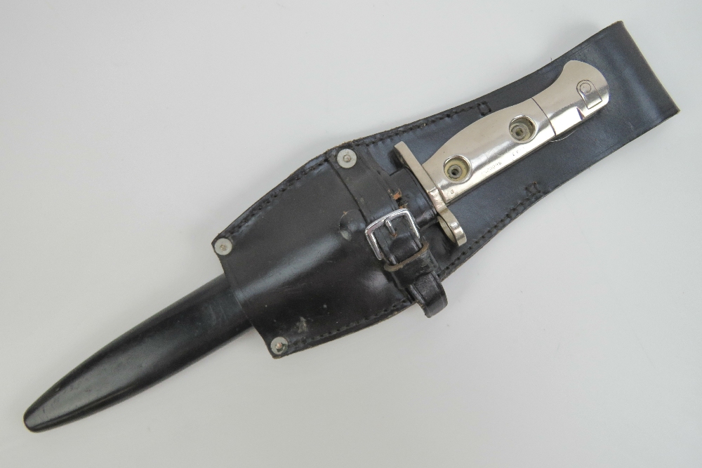 An L1 chromed bayonet with scabbard measuring 32cm in length.