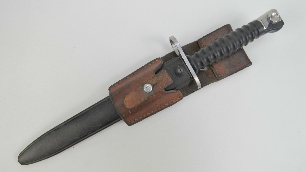 A Swiss bayonet with frog measuring 28cm in length.