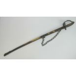 A 19th century cavalry sword having engraving to both sides of the 82cm curved blade,