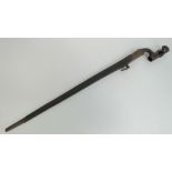 A British Military Boer War era Martini Henry socket bayonet with leather scabbard.