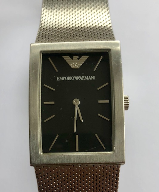 An Emporio Armani gentleman's stainless steel dress watch having black-ground square shaped dial