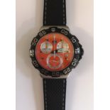 A Tag Heuer Formula 1 2009 wristwatch having orange dial with three subsidiary dials and date