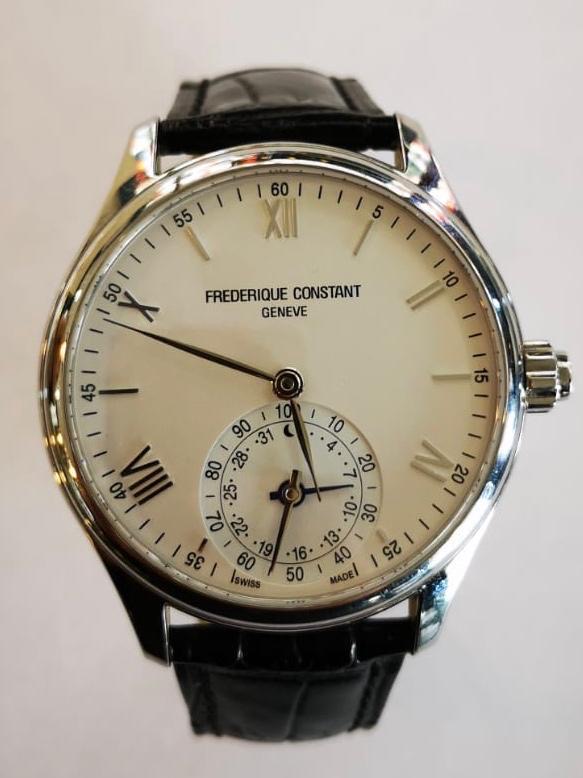 A Frederique Constant Geneve wrist watch having white dial with Arabic and Roman numerals,