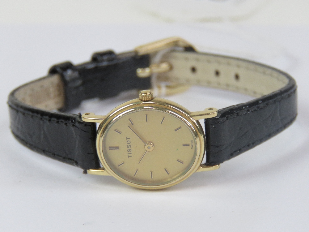 A 9ct gold ladies Tissot wristwatch having yellow metal hands and batons to the oval dial, - Image 4 of 4