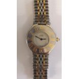A Must De Cartier Bi-metal wristwatch having white dial, Roman numerals to chapter ring,