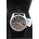 An Emporio Armani stainless steel wristwatch in as new condition complete with box and papers,