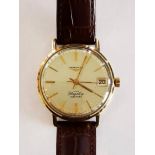 A Longines Flagship automatic wrist watch having white dial with yellow metal hands and batons,