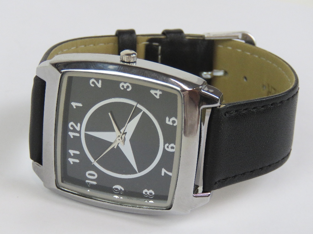 A contemporary Mercedes themed gentlemans wristwatch, having square shaped chromium watch head,