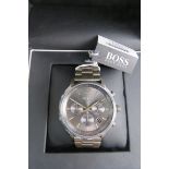 A Hugo Boss stainless steel wristwatch in as new condition complete with box and papers,