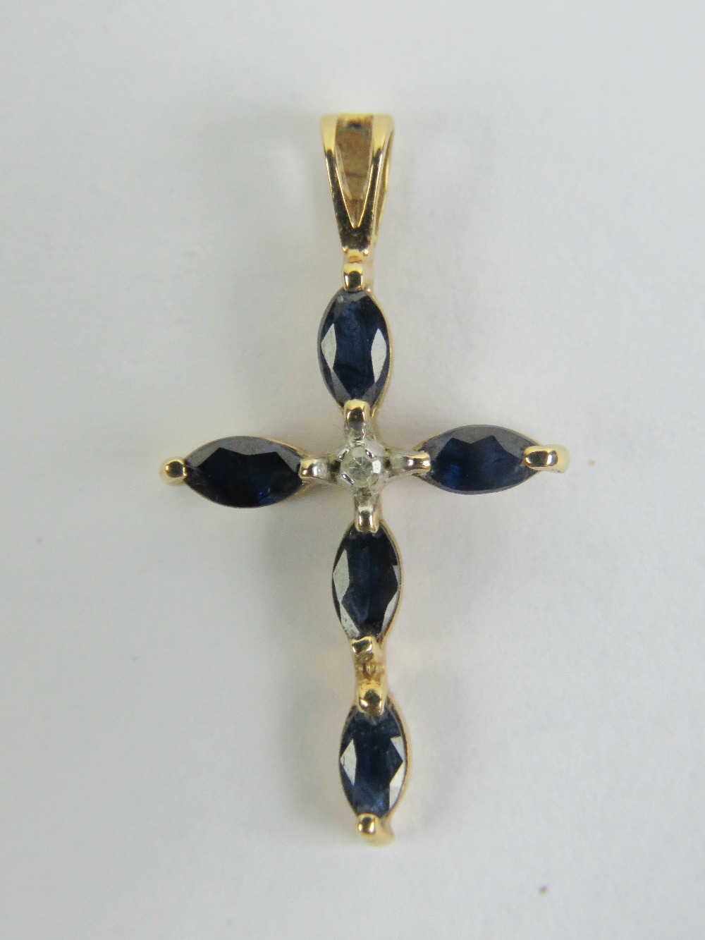 A 9ct gold diamond and sapphire cross,