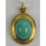 A 9ct gold pendant having green hardstone cabachon to centre, hallmarked 375, 1.