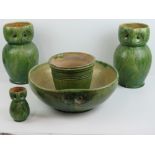 A green glazed pottery wash jug and bowl set, the wash jug in the form of an owl (30cm high,