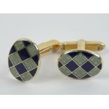 A pair of 9ct gold cufflinks having green and navy chequered enamel, hallmarked 375, 11.8g.